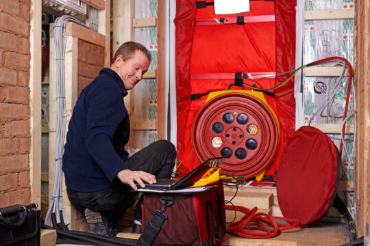 Blower door test HVAC home performance contractors